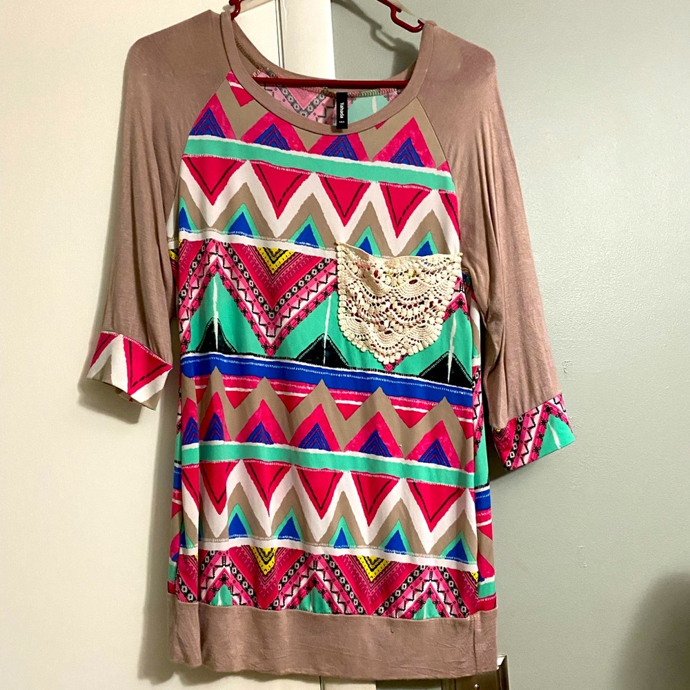 Brand unknown. Size small loose fit. Lightweight
